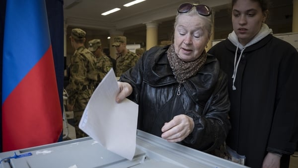 People vote in Russia's parliamentary election at a polling station in Moscow, Russia, on September 18, 2026