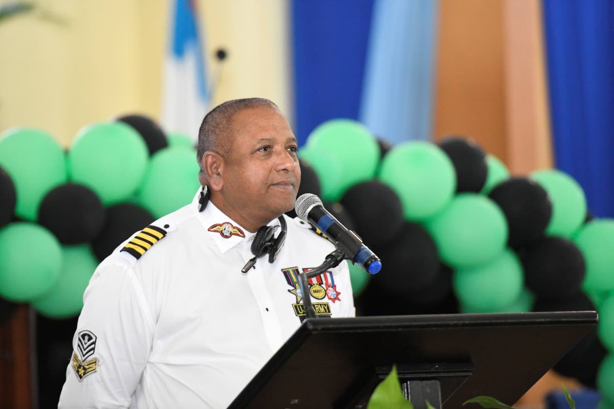 Richie Nembhard gives a tribute at the funeral for veteran broadcaster Dervan Malcolm.