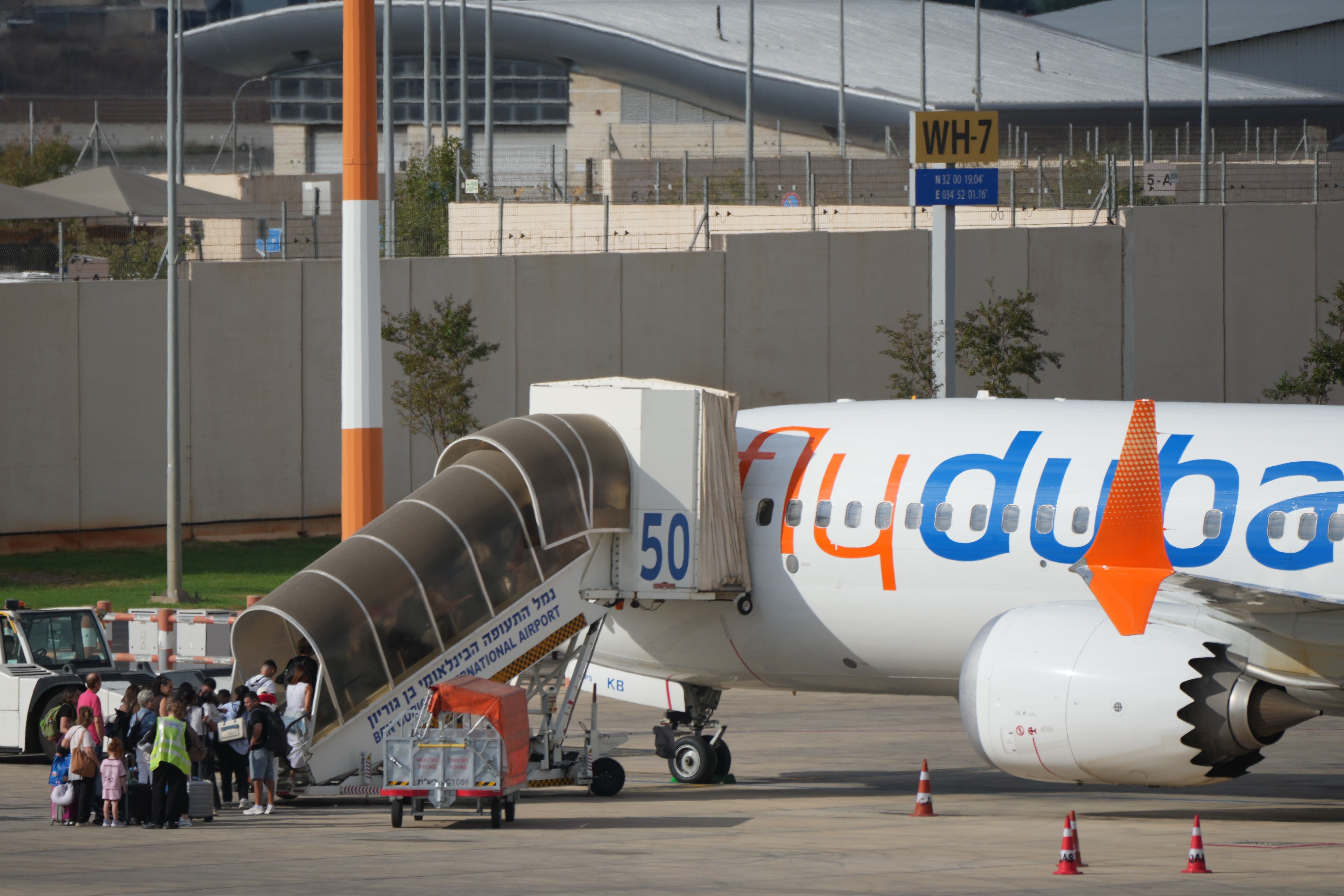 Passengers embark on a FlyDubai aircraft at Ben Gurion International Airport, near Tel Aviv, Israel, (AP)
